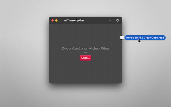Screenshot of AI Transcription running on macOS. A mouse pointer appears to move towards it, dragging a file named “Here’s to the crazy ones”.