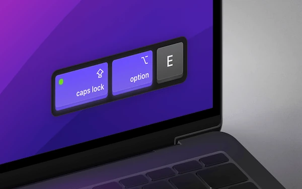 Keystroke Pro running on a MacBook, in the bottom right corner of the screen.